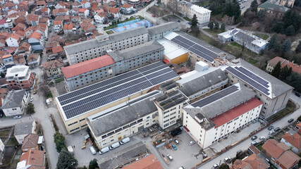 Fototapeta premium Solar panels instaled on buildings captured from drone