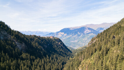 Aerial photo by drone of the Rosière lake and the forest in Courchevel in the Tarentaise valley in France