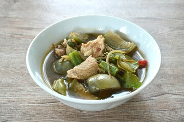 hot and spicy wild boar with variety vegetable and Thai herbs soup on bowl  