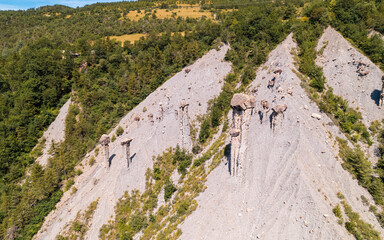 Aerial photography by drone of the rock formations, the Demoiselles Coiffées in Serre-Ponçon and...