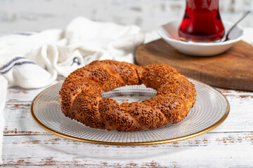 Sesame bagel in a plate. Oven product. local name simit. Close up