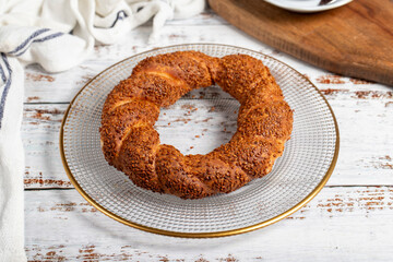 Sesame bagel in a plate. Oven product. local name simit