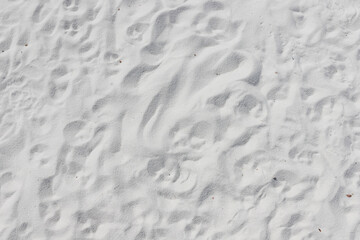 Fine white sand that glistens and reflects the sunlight.