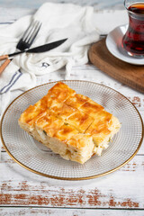 Cheesy borek. Bakery products. Cheese pastry on a white background. local name peynirli su b&ouml;rek