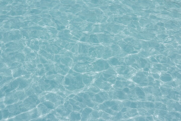 The light reflects blue in the water in the swimming pool. It looks fresh and lively, suitable for use as a wallpaper.