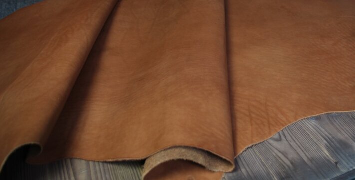 Natural leather texture surface of cognac color
