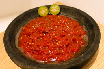 Red chilies are processed into hot sauce