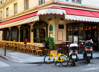 Cozy street with tables of cafe  in Paris, France. Cityscape of Paris. Architecture and landmarks of Paris - 745817138