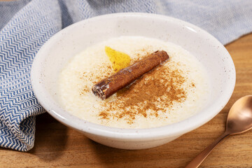 Homemade rice pudding in a bowl with cinnamon ready to eat