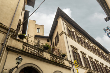 Balcony and lantern on a house wall in Florence