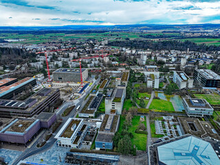 Fototapeta premium Aerial view from Hönggerberg with Federal Institute of Technology ETHZ at Swiss City of Zürich on a cloudy winter afternoon. Photo taken February 24th, 2024, Zurich, Switzerland.