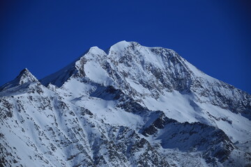 Fototapeta na wymiar snowcaped mountains in canton valais in the swiss alps