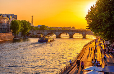 Sunset view of embankment of Seine river and Pont Neuf is the oldest bridge across the river Seine in Paris, France. It is one of the symbols of Paris. - 745823597