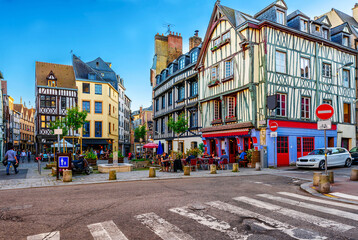 Cozy street with timber framing houses and tables of restaurant in Rouen, Normandy, France - 745824148