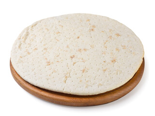 Pizza base on a wooden board closeup on a white background. Isolated