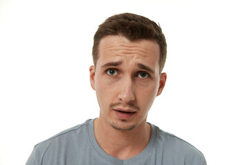 Portrait of offended young man on white background. sadness