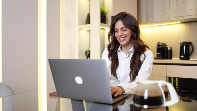 Happy woman working at her home office