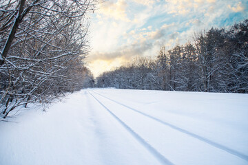 Snow-covered railway tracks. Empty railway in winter.