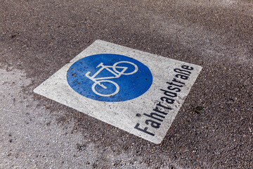 sign bicycle lane painted at the street