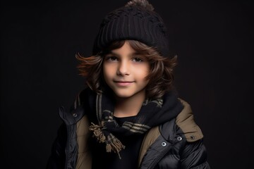 Fototapeta na wymiar Portrait of a cute little boy in winter clothes. Studio shot.