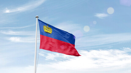 Liechtenstein national flag cloth fabric waving on the sky.