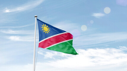 Namibia national flag cloth fabric waving on the sky.
