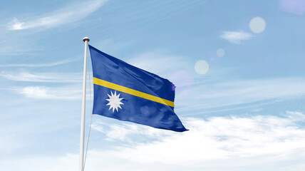 Nauru national flag cloth fabric waving on the sky.