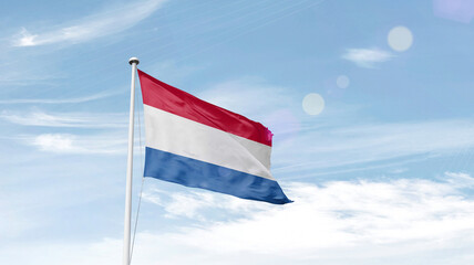 Netherlands national flag cloth fabric waving on the sky.