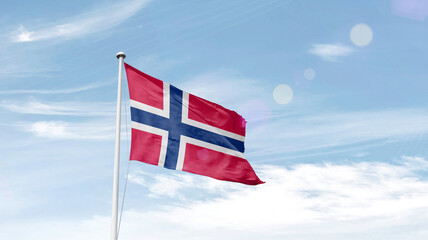 Norway national flag cloth fabric waving on the sky.