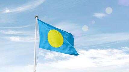 Palau national flag cloth fabric waving on the sky.