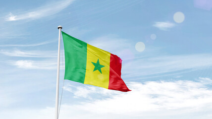 Senegal national flag cloth fabric waving on the sky.