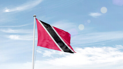 Trinidad and Tobago national flag cloth fabric waving on the sky. - obrazy, fototapety, plakaty