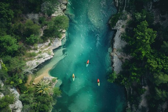 Kayakers Navigating Through Crystal Clear River Waters.