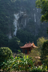 Temple roof of of Buddhist Đầm sen Bích Động with Mountain Background © Chris