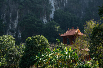 Temple roof of of Buddhist Đầm sen Bích Động with Mountain Background © Chris