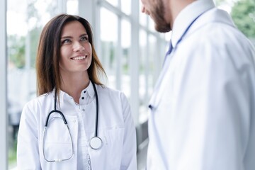 Fototapeta premium Medical Staff Having Discussion In Modern Hospital Corridor.
