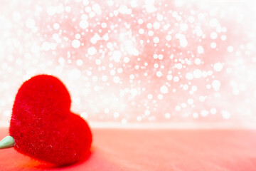 Fototapeta premium Valentine's day background with red heart on bokeh background.