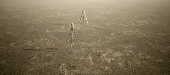 Two land surveyors on tripod standing on wide open flat landscape. High angle view. - 745846518
