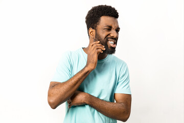 Portrait of a joyful African American man in a blue shirt expressing happiness, isolated against a white background. Perfect for diverse marketing and emotive concepts. - 745849198