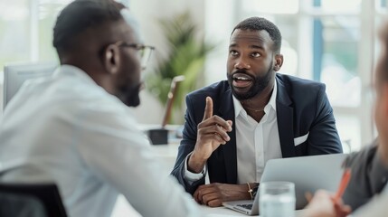 Two diverse business executive partners negotiating at board meeting, manager adviser consulting client discussing financial partnership contract sitting at table in office. Job interview concept. - obrazy, fototapety, plakaty