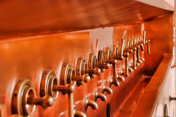 close up view of a copper brewery machine
