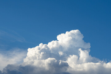 Naklejka na ściany i meble Bright blue sky with white clouds. High quality photo