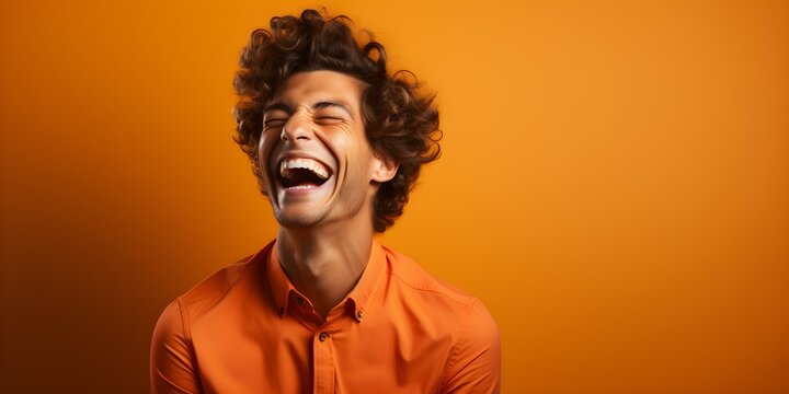 Closeup of a man laughing heartily in an orange studio setting. Concept Portraits, Laughter, Closeup, Orange Studio, Joyful Expressions