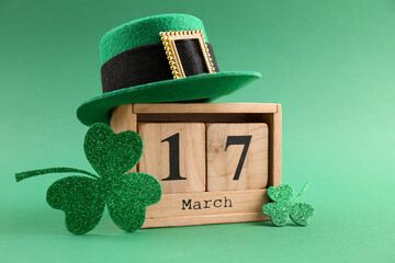 St. Patrick's day - 17th of March. Wooden block calendar, leprechaun hat and decorative clover...