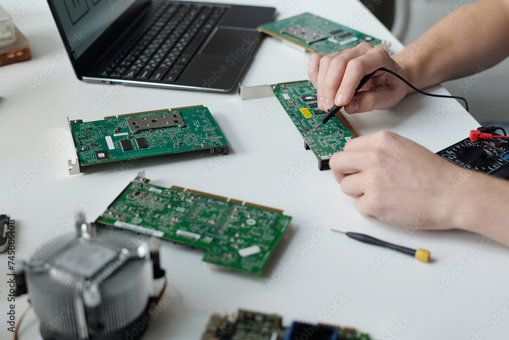 Poster hands of unrecognizable male technician of troubleshooting service center repairing computer motherb