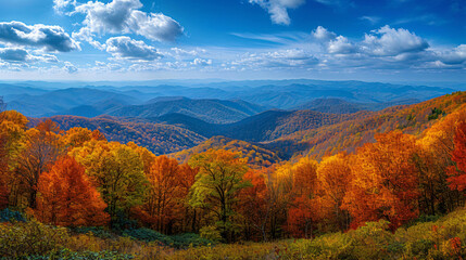 A panoramic view of a mountain range during autumn.