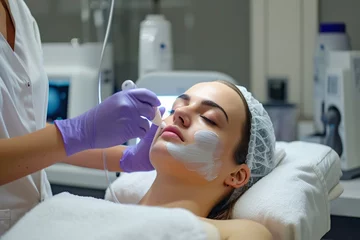 Foto op Plexiglas Schoonheidssalon Close-up of a patient receiving a specialized facial treatment in a modern medical clinic