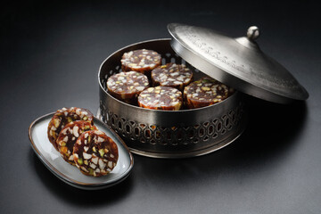 Healthy snacks, fitness lifestyle and high fiber diet concept with dates and dryfruits energy bars surrounded by dried fruits, Cashew Nuts, pistachios , almonds