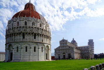 The Pisa Baptistery of St. John, The Cathedral and The Leaning Tower of Pisa in Square of Miracles, Tuscany , Italy.