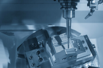 The 5-axis CNC milling machine  cutting the automotive part with solid ball end mill tool.